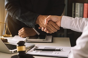 men shaking hands for a business law contract agreement